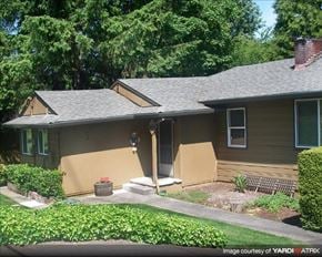 Portland apartment for rent - A house with a brown roof and a small front porch.