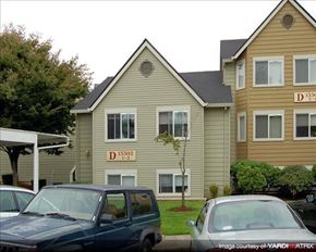 Clackamas apartment for rent - A building with the number 15302 on it is in front of a tree.