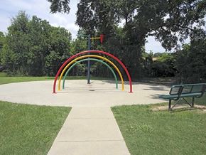 Baton Rouge townhouse for rent - a rainbow in a park next to a bench