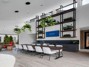 Harrison apartment for rent - a dining room with a table and chairs and plants
