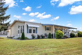 New Providence apartment for rent - A house with a white fence and a small porch.