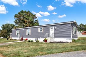 New Providence apartment for rent - A grey house with a red fire hydrant in front.