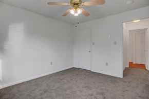 Shippensburg apartment for rent - a bedroom with white walls and a ceiling fan