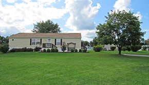 Dover apartment for rent - A house with a lawn in front of it.