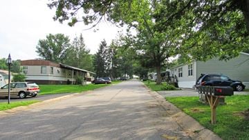 Dover apartment for rent - a street with houses and cars parked on the side of the road