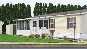 Ephrata apartment for rent - A house with a white porch and a basketball hoop in the backyard.
