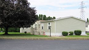 Ephrata apartment for rent - A house with a grey siding and a red and white sign on the front.