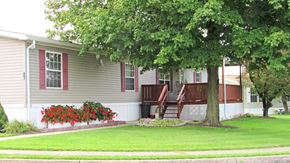 Ephrata apartment for rent - A house with red window frames and a deck.