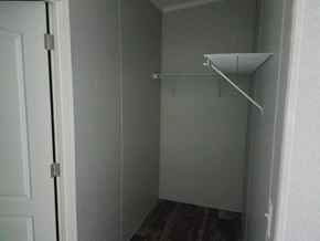 Drums apartment for rent - A white door is open to a small closet with a shelf.