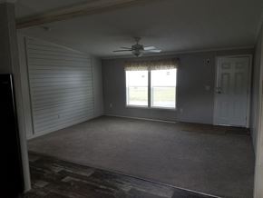 Drums apartment for rent - A room with a ceiling fan and sliding glass doors.