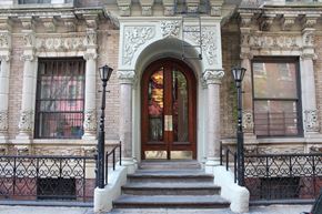 New York apartment for rent - the front of a building with a door and stairs
