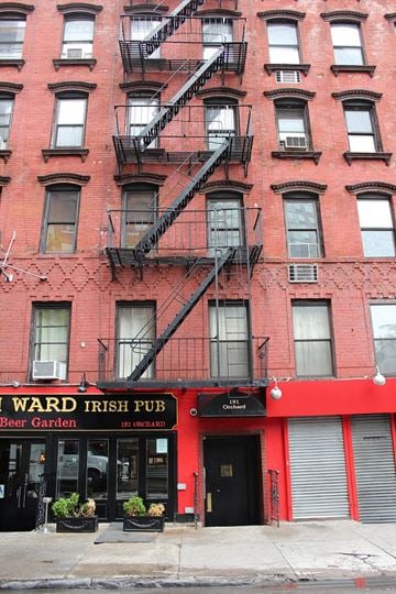 New York apartment for rent - a red building with a fire escape on the side of it