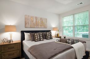 Allentown apartment for rent - a bedroom with a large bed and two windows