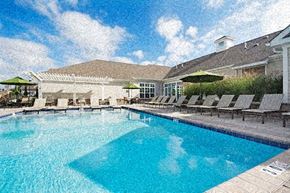 Allentown apartment for rent - a large swimming pool with chairs and umbrellas