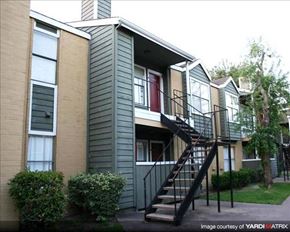 Houston apartment for rent - an apartment building with stairs and a
