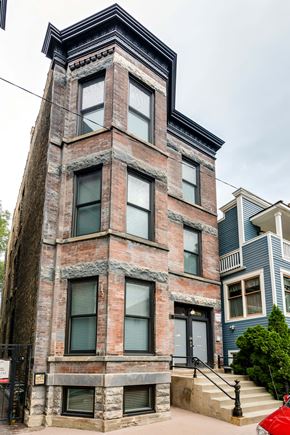 Chicago apartment for rent - an old brick building with a tower on top of it