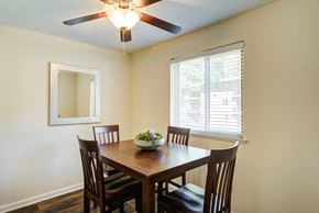Glen Burnie apartment for rent - a dining room with a table and chairs and a ceiling fan