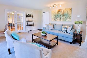 Glen Burnie apartment for rent - a living room with a couch and a table