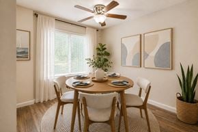 Glen Burnie apartment for rent - A dining room with a table set for two and a ceiling fan.