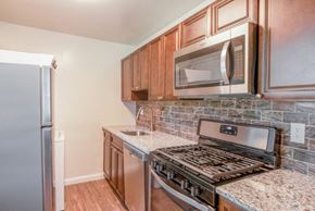 Glen Burnie apartment for rent - a kitchen with a stove and a microwave