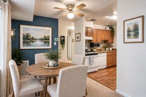 Laurel apartment for rent - A dining room with a table and chairs is shown.