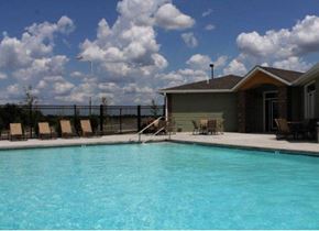 Gardner apartment for rent - a swimming pool with chairs and a house