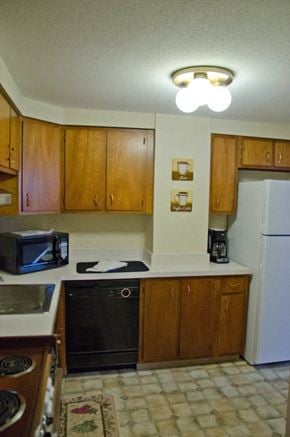 Topeka apartment for rent - a kitchen with a stove and a refrigerator