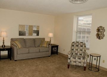Topeka apartment for rent - a living room with a couch and a chair