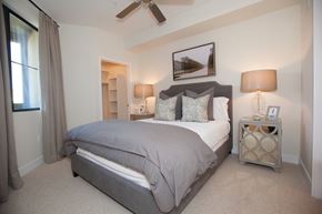 Scottsdale apartment for rent - A bedroom with a large bed and a ceiling fan.