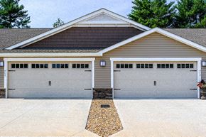Greer apartment for rent - A two-car garage with a brown roof and white trim.