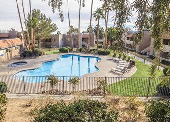 An aerial view of a swimming pool in a resort