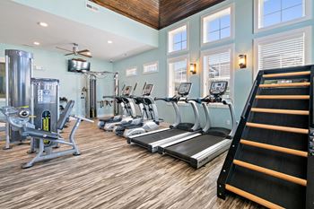 24-Hour health hub fitness center with cardio and free weights