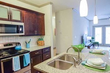 Custom espresso cabinetry with frosted glass in kitchens*