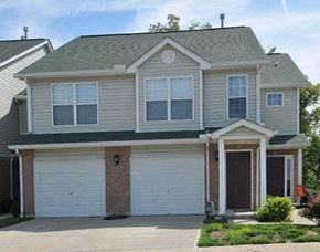 Wilder townhouse for rent - a white house with white garage doors