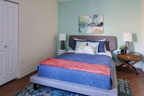 Boston apartment for rent - a bedroom with a bed with a blue comforter and pillows