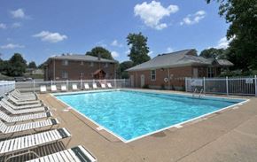 Erlanger apartment for rent - a swimming pool with white chairs around it