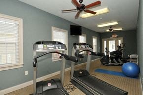 Ft. Mitchell townhouse for rent - a gym with exercise equipment and a ceiling fan