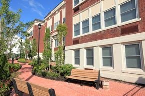 New Brunswick apartment for rent - a brick building with benches in front of it