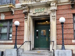 Worcester apartment for rent - the front of a brick building with a green door