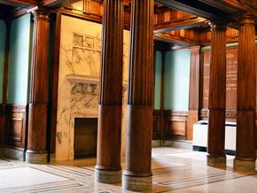 Worcester apartment for rent - the lobby of a building with pillars and a fireplace