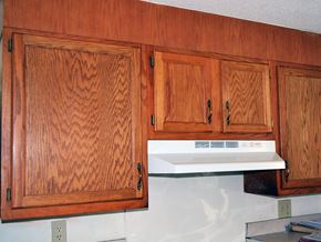 New Haven apartment for rent - a kitchen with wooden cabinets and a white stove