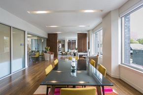 Denver apartment for rent - a large dining room with a table and chairs