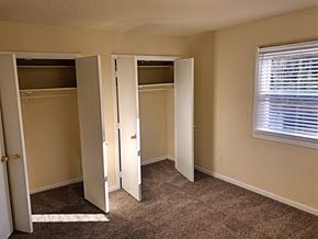 Raleigh apartment for rent - a bedroom with three closets and a window