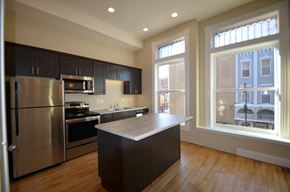 La Crosse apartment for rent - a kitchen with stainless steel appliances and a large window