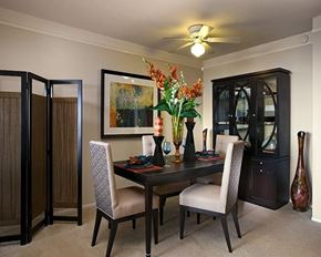 Rancho Palos Verdes apartment for rent - A dining room with a table, chairs, and a vase of flowers.