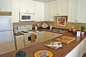 Alameda apartment for rent - a kitchen with white cabinets and a counter top