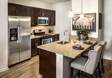 Pearl River apartment for rent - a kitchen with stainless steel appliances and a granite counter top