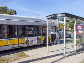 West Roxbury apartment for rent - a yellow and white bus at a bus stop