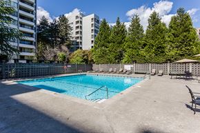 New Westminster apartment for rent - A small pool surrounded by a concrete patio and trees.