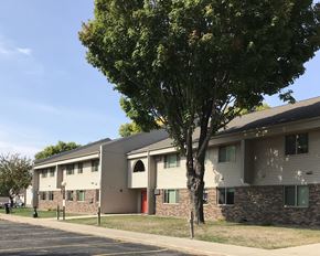 Willmar And  Alexandria apartment for rent - an apartment building with a tree in front of it